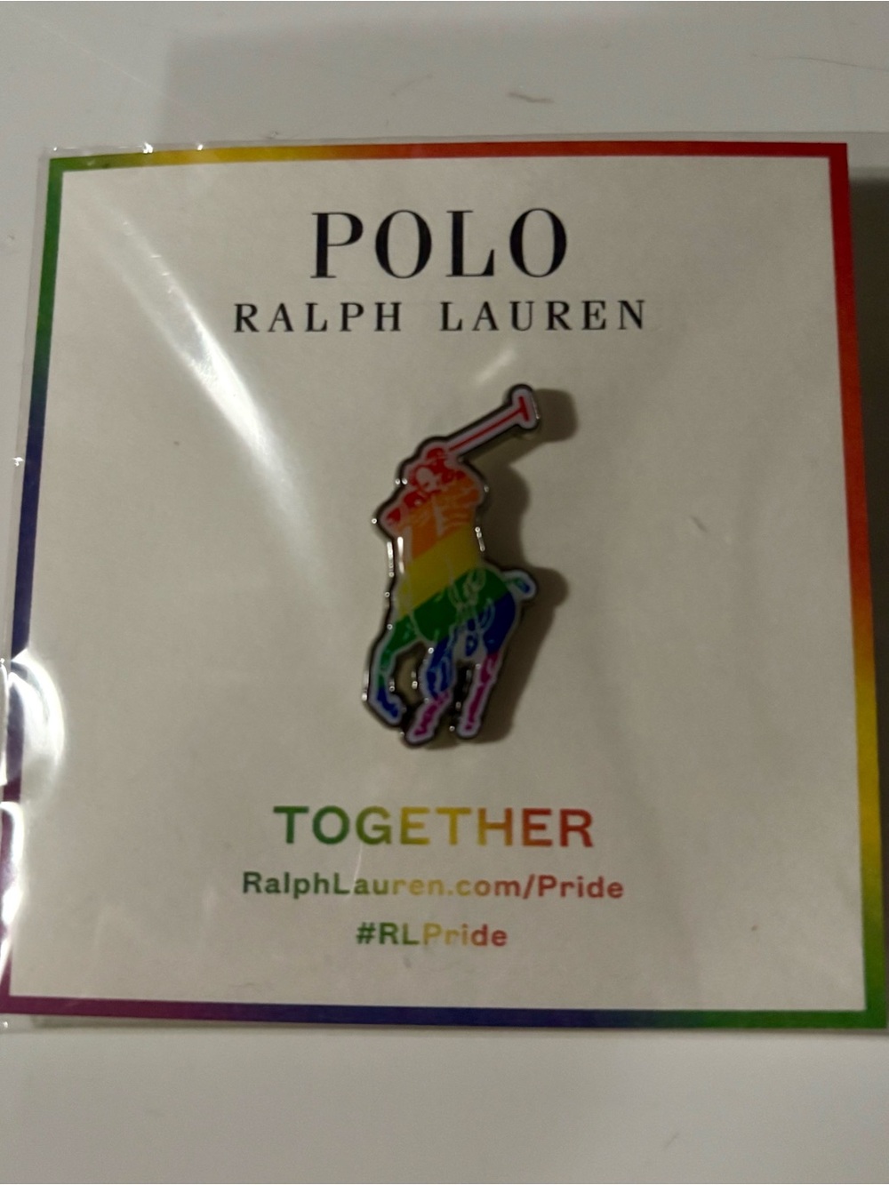 NEW Polo RL Pride pin with rainbow-colored polo player